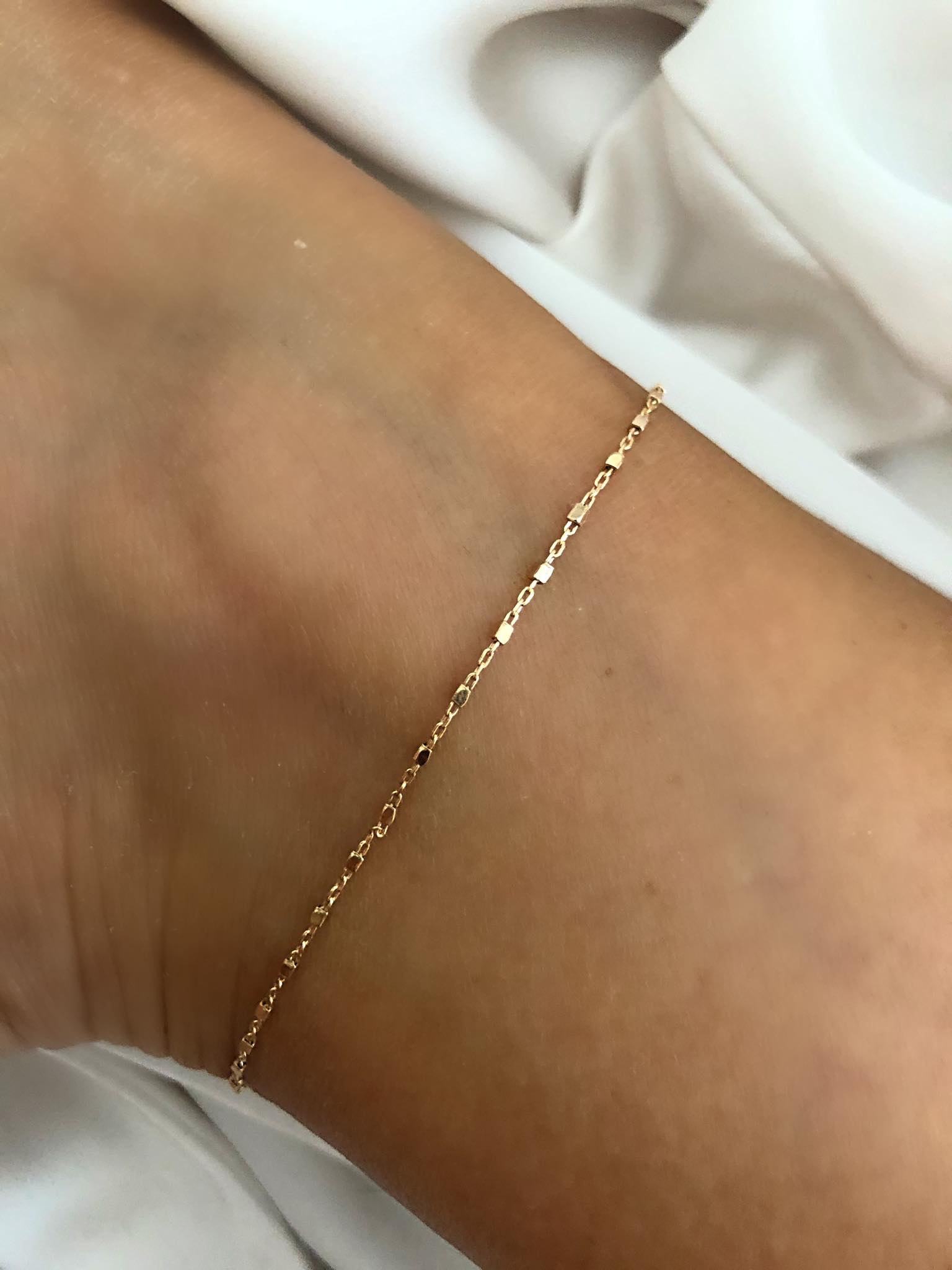 cavigliera catena e dadini